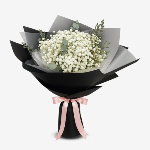 Bouquet of white baby's breath flowers wrapped in black paper with a pink ribbon.