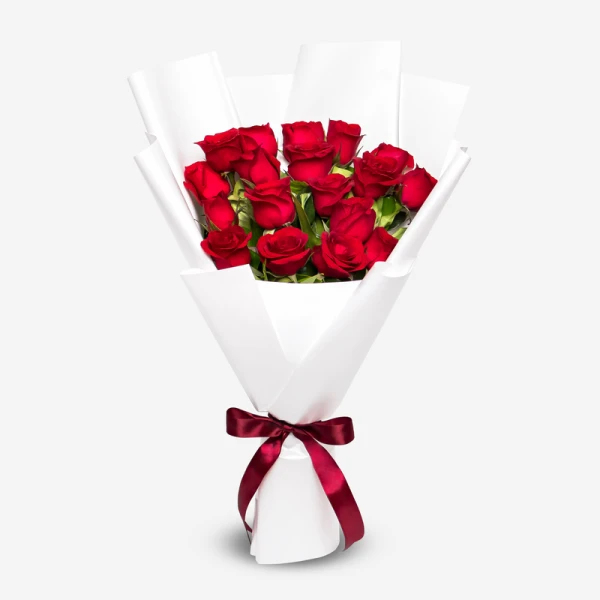 Bouquet of 18 red roses with white paper wrapping and a burgundy ribbon.