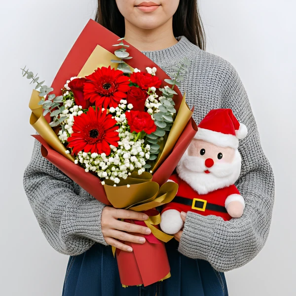 Woman holding a red Gerbera daisy and rose bouquet and a plush Santa Claus toy.