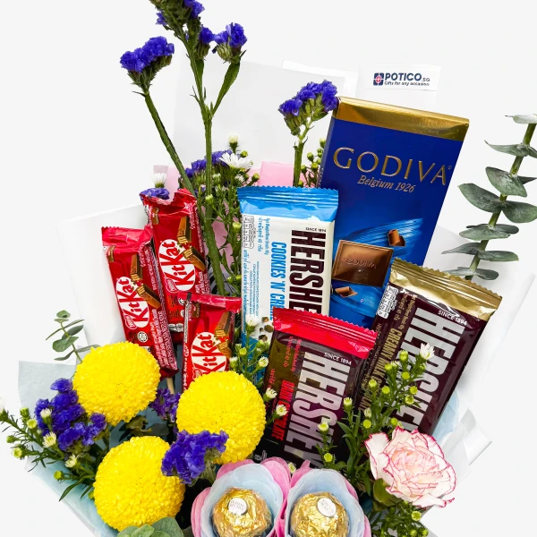 Chocolate bouquet with Hershey's, Kit Kat, Godiva, Ferrero Rocher, and yellow chrysanthemums.
