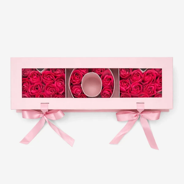 Pink box with "MOM" spelled out in pink soap roses, tied with pink ribbons.