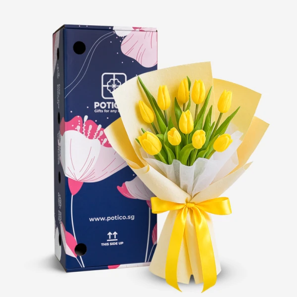 A bouquet of 10 bright yellow tulips with green leaves, wrapped in cream and yellow paper, tied with a yellow ribbon.