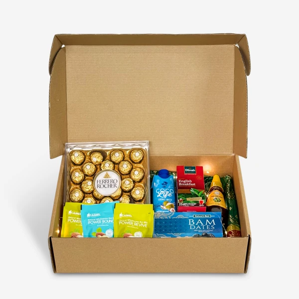 Ramadan Royale gift box with Ferrero Rocher, tea, dates, and nut mixes.