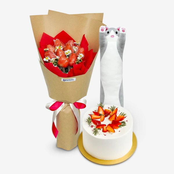 Strawberry bouquet, white cake with strawberries, and a cat-shaped plushie.