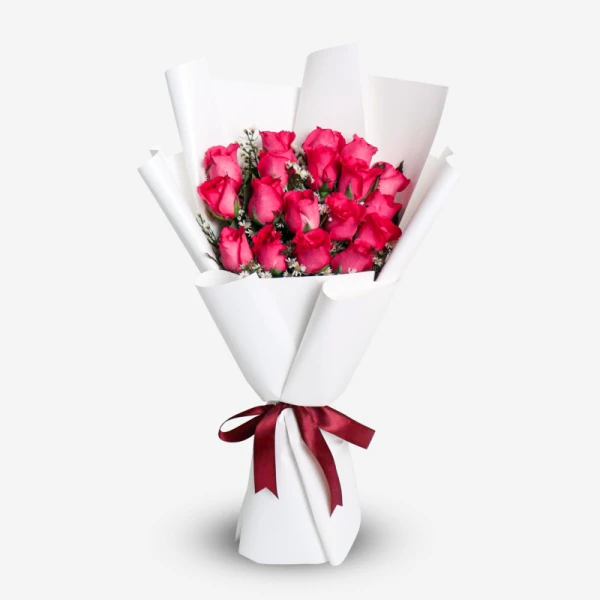 Bouquet of 18 pink roses with white accents, wrapped in white paper and tied with a burgundy ribbon.