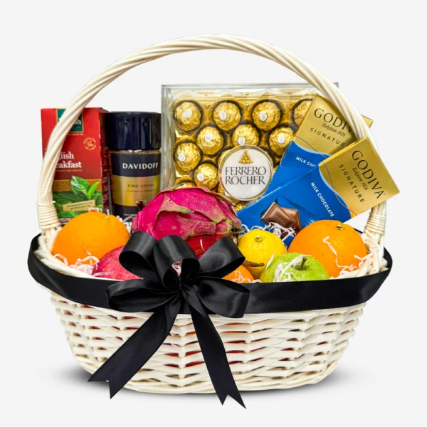 Gift basket with fruits, Ferrero Rocher, Godiva chocolates, tea, and coffee.