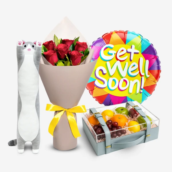 Get Well Soon bundle: long cat plush, red roses, colorful balloon, and fruit basket.