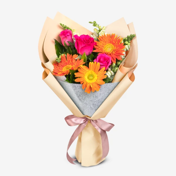 Bright bouquet with pink roses and orange gerbera daisies, wrapped in tan paper with a pink bow.
