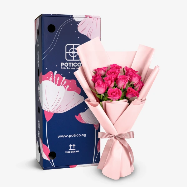 Bouquet of 12 pink roses in pink paper with a blue gift box.