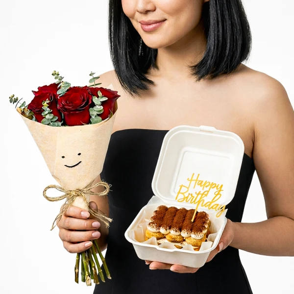 Woman holds red roses and a tiramisu cake with "Happy Birthday" decoration.