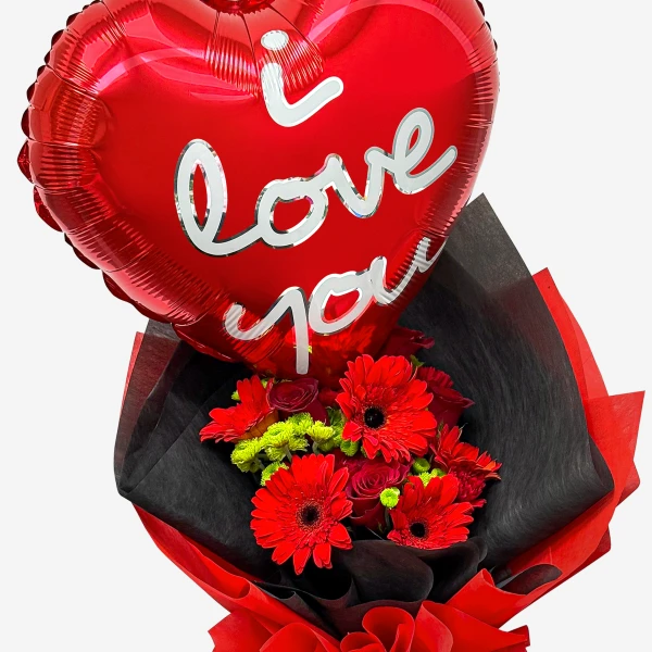 Heart-shaped "I love you" balloon above a bouquet of red roses, carnations, and gerberas.