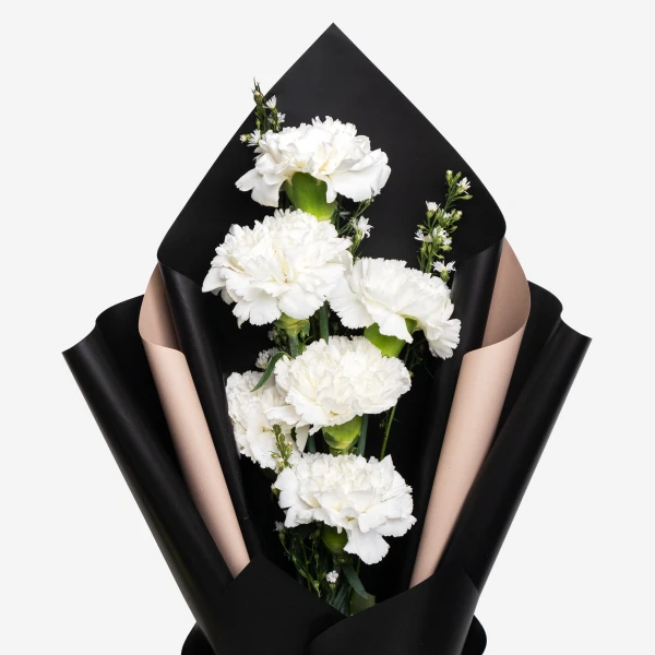 White carnation bouquet with black and tan wrapping.