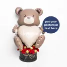 Bear balloon with heart saying "i love you", surrounded by red carnations and chocolates.