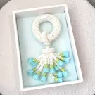 Handmade white jasmine malai garland with light blue flowers in a gift box.