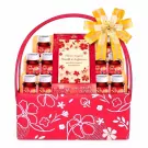Red gift basket with Veta Berry Plus bottles and a 'Cheers to you' card, tied with a yellow bow.