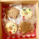 Gingerbread men and wreath cookies in a Christmas gift box, individually wrapped.