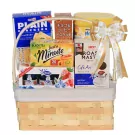 A gift basket filled with coffee, tea, crackers, cookies, and berry jams, topped with a gold and white ribbon.