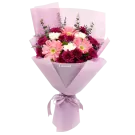 Bouquet of pink gerberas, white carnations, and purple mums in pink wrapping, tied with a ribbon.