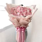 Blush Delight Money Bouquet with pink flowers and ribbon, holding cash shaped into flowers.