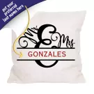 Personalized pillow with "Mr. & Mrs. Gonzales" in script font above "GONZALES" in block font.