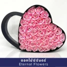 Pink heart-shaped box filled with 60 artificial pink roses, each with a small diamond in the center.