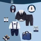 Baby boy's navy pinstripe suit romper, bib, socks, and shoes in a blue suitcase gift set.
