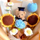 Crochet graduation bouquet with teddy bear, sunflowers, tulips, carnations, and daisies.