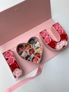 Pink gift box with "I Love You" spelled out in chocolate strawberries and faux roses.