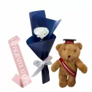 Graduation teddy bear, flower bouquet, and pink "Congratulations" sash.