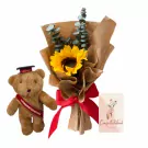 Teddy bear with graduation cap and sash, sunflower bouquet, and "Congratulations" card.
