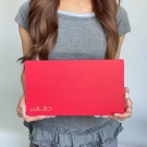 Woman holding a red chocolate box with "Always Yours Chocolate" logo.