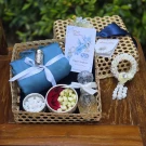 Songkran gift set: blue scarf, silver inhaler, flower bowls, perfume, and artificial garland.