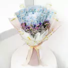 Money bouquet with dried flowers and clear placeholders for cash, tied with a ribbon.