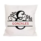 A white pillow with "Mr. & Mrs. GONZALES" printed on it.