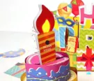 Pop-up birthday card with a lit candle and "Blow Here" text.