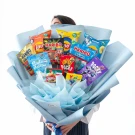 A snack bouquet with chips, candies, and Pocky sticks wrapped in light blue paper.