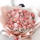 Pink money bouquet with artificial flowers, a creative gift.