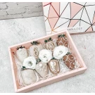Mini gift box of chocolate-dipped strawberries with white flowers.