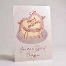 Birthday card with a heart-shaped cake saying "Happy Birthday" and "You are a slice of perfection."
