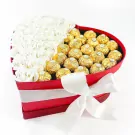 Red heart box with white roses and Ferrero Rocher chocolates, tied with a white ribbon.