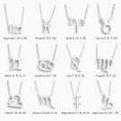 Gold zodiac sign necklaces, each with its astrological symbol and dates.