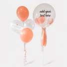 Peach bubble balloon with "Will You Marry Me?" text and a bouquet of peach and white balloons.