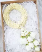 White Malai with jasmine and roses in a gift box.