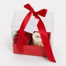 Vanilla strawberry heart cake and red rose box with red ribbon.