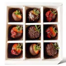 Box of 9 chocolate-covered strawberries with various toppings like sprinkles and dried fruit.