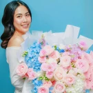 An grand fresh bouquet featuring a dreamy blend of serene blue hydrangeas and pastel pink roses.