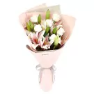 Bouquet of pink stargazer lilies and white roses in pink paper with a grey ribbon.