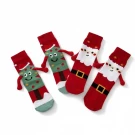 Four Christmas socks with arms and legs, two Santas, two trees, on a white background.