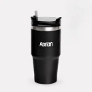 Black personalized tumbler with "Adrian" etched on it and a straw.