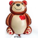 Brown teddy bear balloon with a red heart on its chest and paws with red hearts.